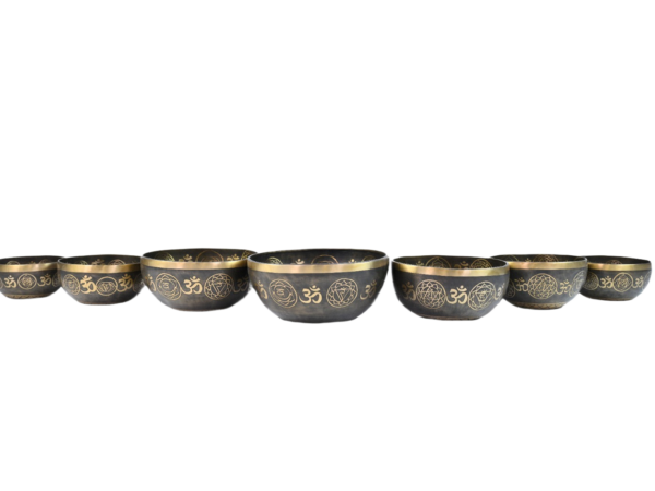 meditating buddha with sacred om, chakra, and mandala symbols 7 chakra singing bowls set