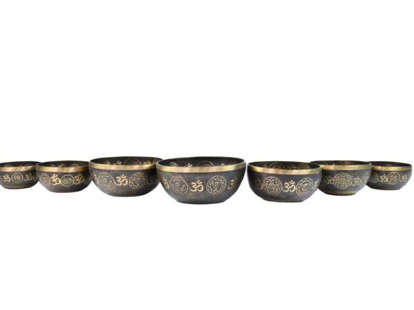 meditating buddha with sacred om, chakra, and mandala symbols 7 chakra singing bowls set